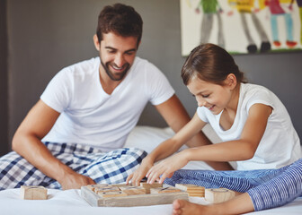 Father, child or playing a board game in home for bonding, problem solving or educational...
