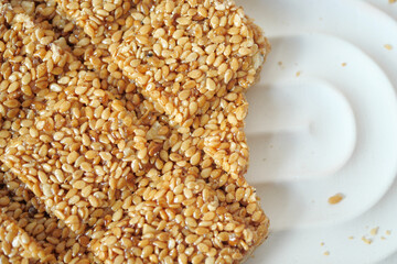 This is a delightful closeup photograph showing a homemade sesame seed brittle treat