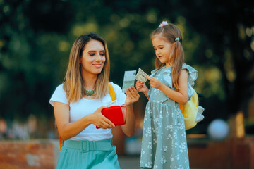 Mother Giving Lunch Money Allowance to her Little Daughter. Kid receiving pocket money for school...