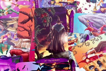 Tarot cards, Waite Rider tarot cards, the hermit card in the foreground on a background of available deck cards