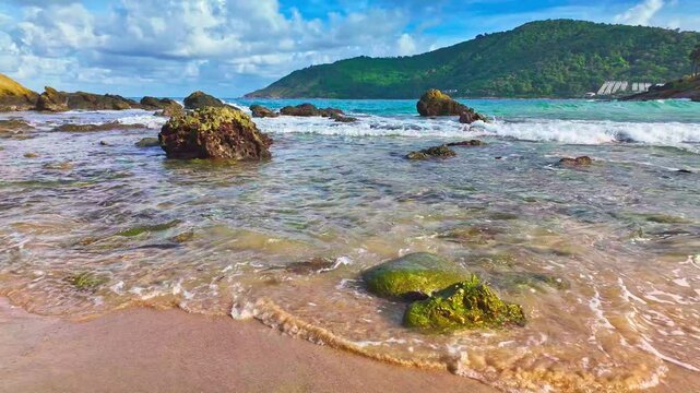 Slow motion video of the waves hitting the reef along Yanui Beach. The aqua blue sea.
the clean sea and quiet with white sand beach. Amazing place of tourist attractions. Snorkeling location.