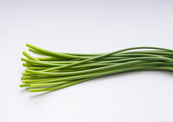 Close up of raw garlic sprouts on white floor, South Korea
