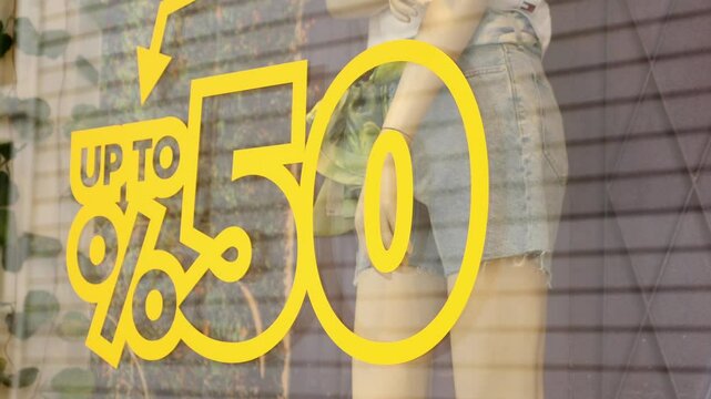 Large Sale text letters on red background on clothing store .