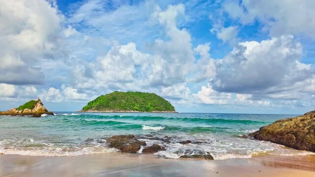 White waves crashing against the white sand beach in slow motion
Ya Nui beach is the good place for swimming snorkeling and sea canoe.green sea background. creative nature and travel concept.