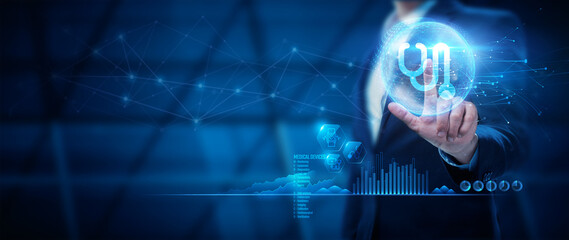 Businessman holding an icon of medical devices. Medical Devices Concept.