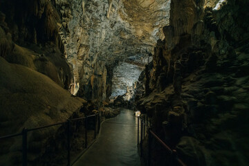 Obraz premium Landscape View Of The Beautiful And Amazing Stalactites On The Trails Of Postojna Cave Park, Postojna , Slovenia