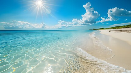 Pristine beach with crystal clear turquoise water, white sand, and bright sunshine
