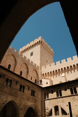castle of a Palais des Papes, view through a window