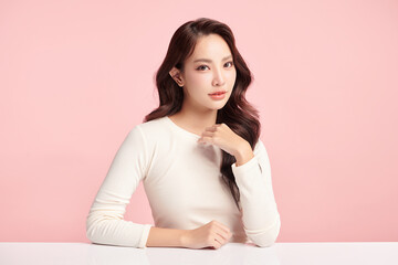 Obraz premium Beautiful young asian woman with clean fresh skin on pink background, Face care, Facial treatment, Cosmetology, beauty and spa, Asian women portrait.
