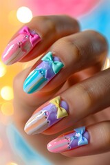 Fototapeta premium A woman holding a nail with bows and colorful designs.