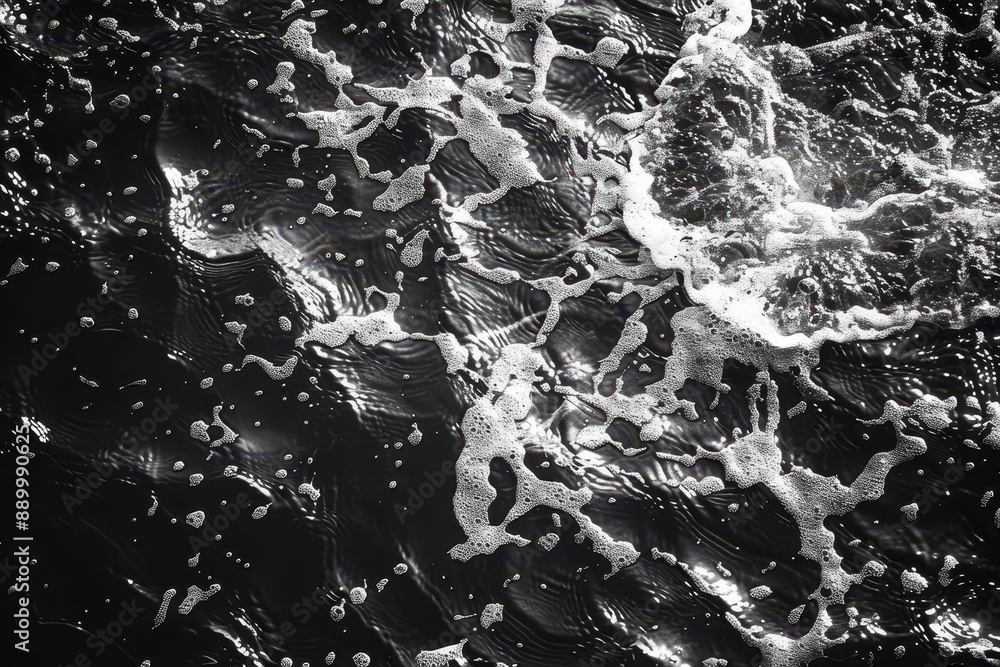 Poster top view of black and white abstract pattern in water with ripples on a sunny summer day.