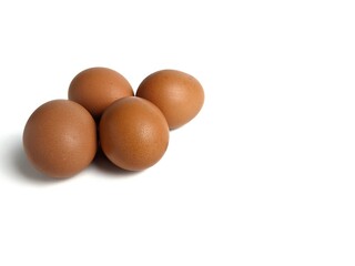 Brown chicken eggs isolated against white background