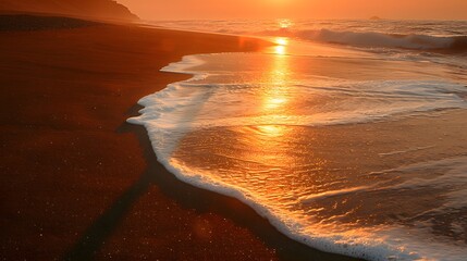 Man's shadow on the beach at sunset