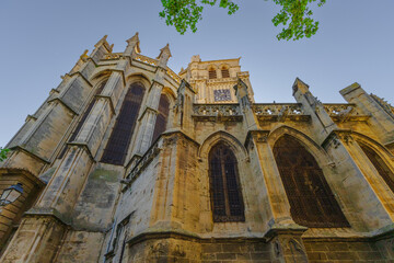 Cathedral Saint-Nazaire-A river runs through a town with a castle in the background