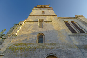 Cathedral Saint-Nazaire-A river runs through a town with a castle in the background