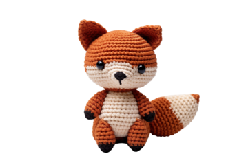 A Hand-Crocheted Orange and White Fox Plush Toy Sitting on a White Background on a Clear PNG or White Background.