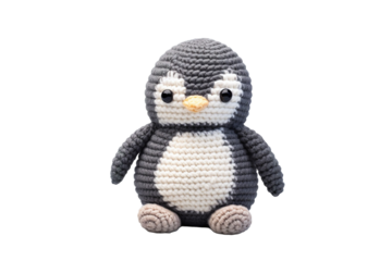 A Hand-Knitted Penguin Toy Sits Against a White Background on a Clear PNG or White Background.