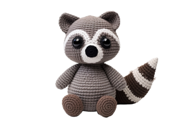 A Whimsical Crochet Raccoon Plush Sitting Against A Pure White Background on a Clear PNG or White Background.