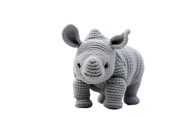 A Hand-Knitted Rhino Toy Poses for a Close-Up Portrait on a Clear PNG or White Background.