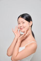 A female model touching her clear and clean face with both hands. Korean cosmetics female model.