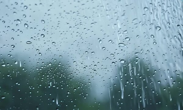 a water wet window weather transparent drip drops surface glass rain rainfall storm stormy falling condensation windshield backdrop light clear motion raindrop night background