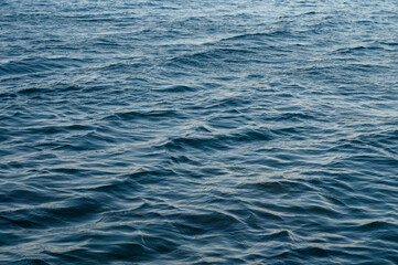 An abstract background of seawater flow under light exposure