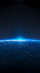 Earth viewed from space with blue lights shining on the horizon