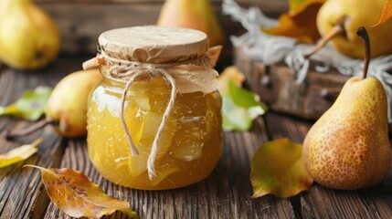 Sweet and healthy pear jam in a glass jar on a wooden kitchen table. A nutritious vegan dessert. Homemade organic marmalade.