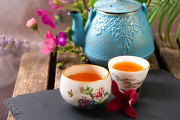 Chinese teapot and teacups with tea