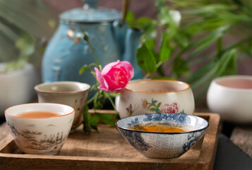 Chinese teapot and teacups with tea