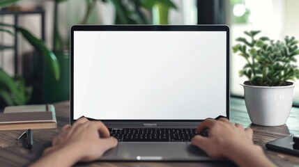 a mockup of a laptop with blank screen with hands typing on the keyboard, office background