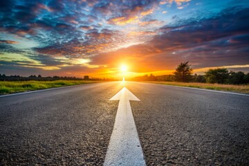 Low angle photography of a white arrow on the asphalt road during the sunset. Straight ahead way concept, path to success direction, business career future guidance, journey to the destination