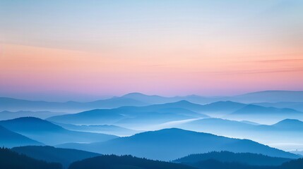 A serene landscape shot of mountains at dawn 