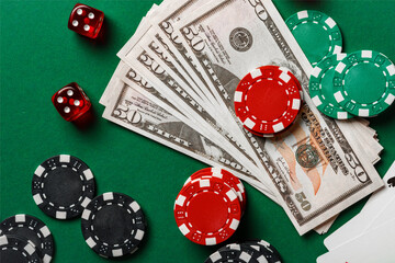 Red Dice, Playing Cards, and Chips on Green Felt Tabletop