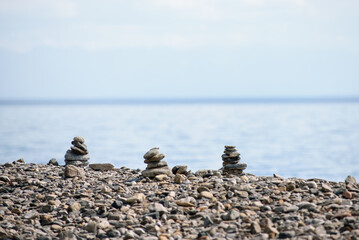 pyramid from the stones on the bank of the pond