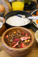 Granola with dried strawberry, seeds and yoghurt