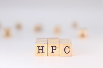 HPC acronym - Concept of High Performance Computing written on wooden cubes isolated on white background with copy space for text.

