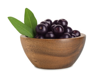 Fresh ripe acai berries in bowl and green leaves isolated on white