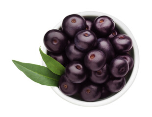 Fresh ripe acai berries in bowl and green leaves isolated on white, top view