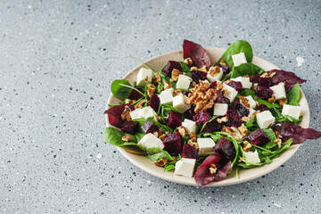 delicious fresh beet salad on a light stone background