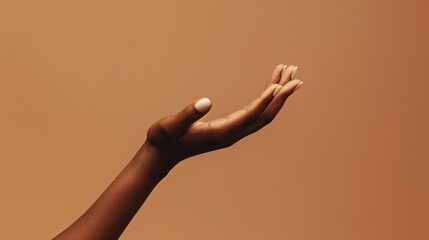 On a brown background, an African American woman's hand, palm facing upwards, is prominently displayed. She showcases an empty hand, emphasizing beauty products.