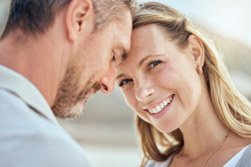 Fototapeta premium Forehead touch, couple and portrait of woman for outdoor date, romantic time and bonding together. Happy wife, husband and love smile in nature with healthy marriage, anniversary vacation and trust
