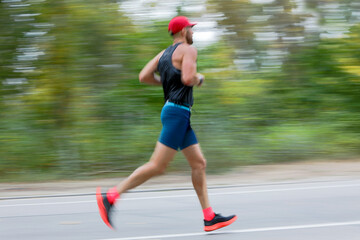 athlete runner on city park