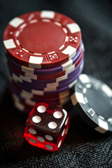 Casino Chips and Dice on a Black Table