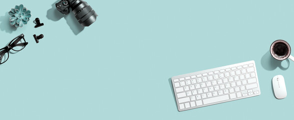 Computer keyboard and SLR camera from above