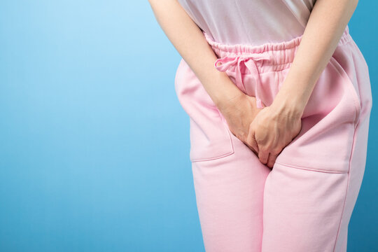 Urinary incontinence, woman holding crotch, female health, chronic disorder, urine leakage.