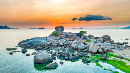 Landscape sunrise on Hon Chong cape, Nha Trang, Vietnam. A peaceful place to welcome peace on the bay © huythoai