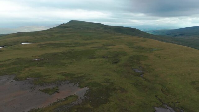 Whernside and surrounding tarns on a cloudy day in yorkshire dales national park, aerial view