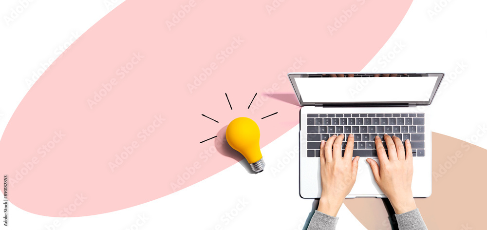 Sticker person using a laptop computer and a light bulb - flat lay