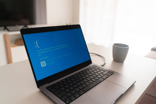 Marbella, Spain - 19 July 2024 IT outage hits worldwide media, blue screen of death on the laptop 